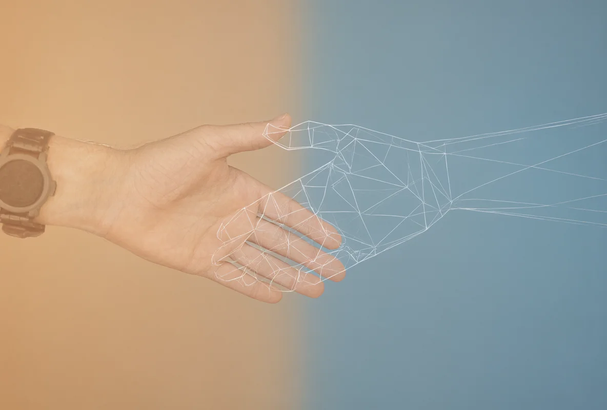 A human hand with a wristwatch reaches to connect with a white wireframe robotic hand against a split tan and blue background.